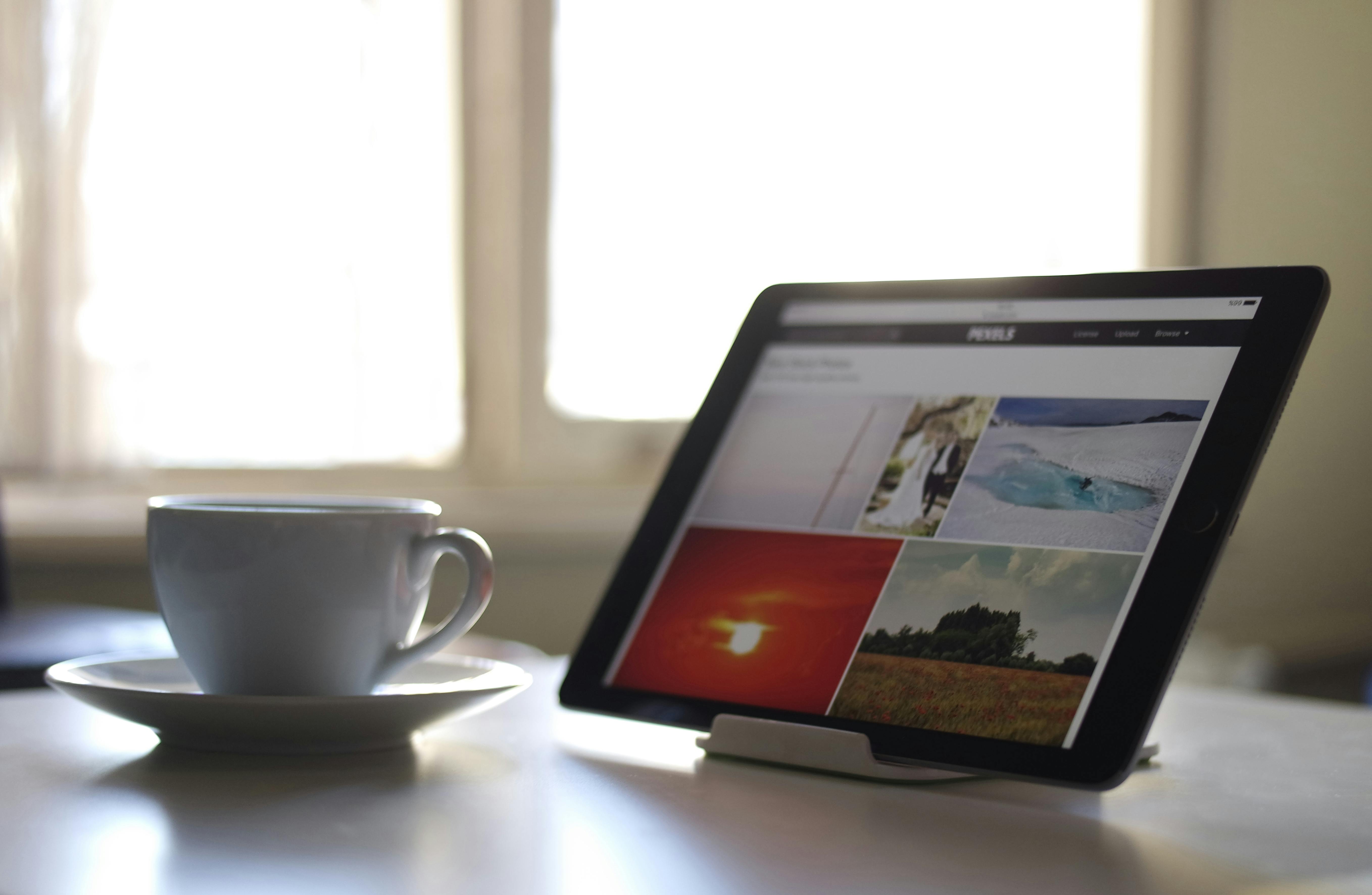 Computer with coffee cup