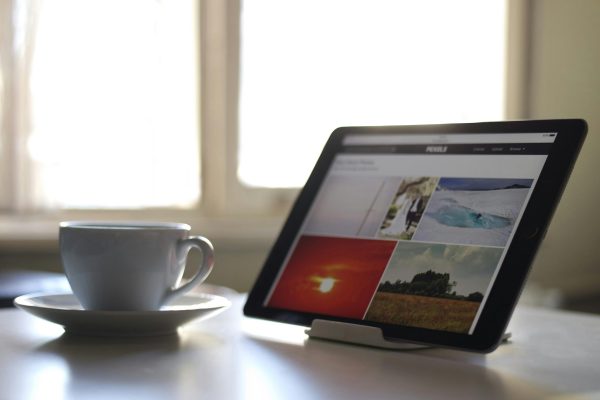 Computer with coffee cup
